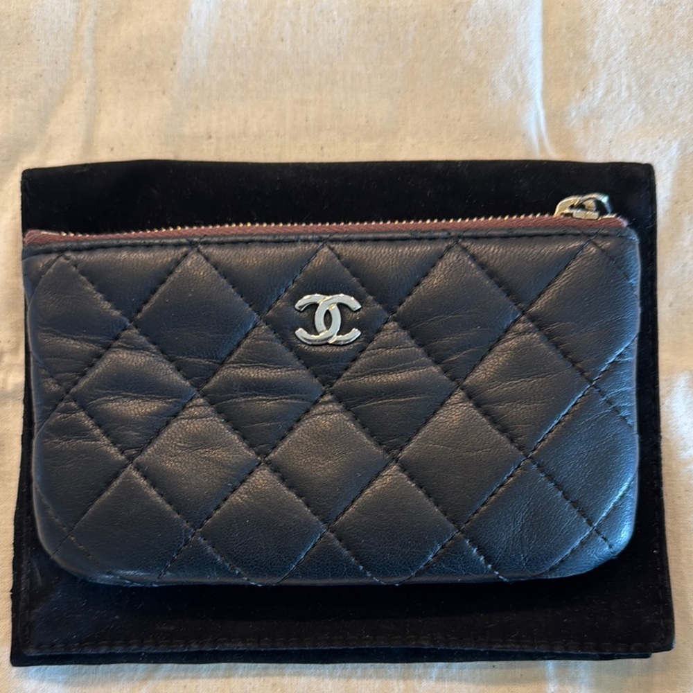 CHANEL Black quilted mini o wallet